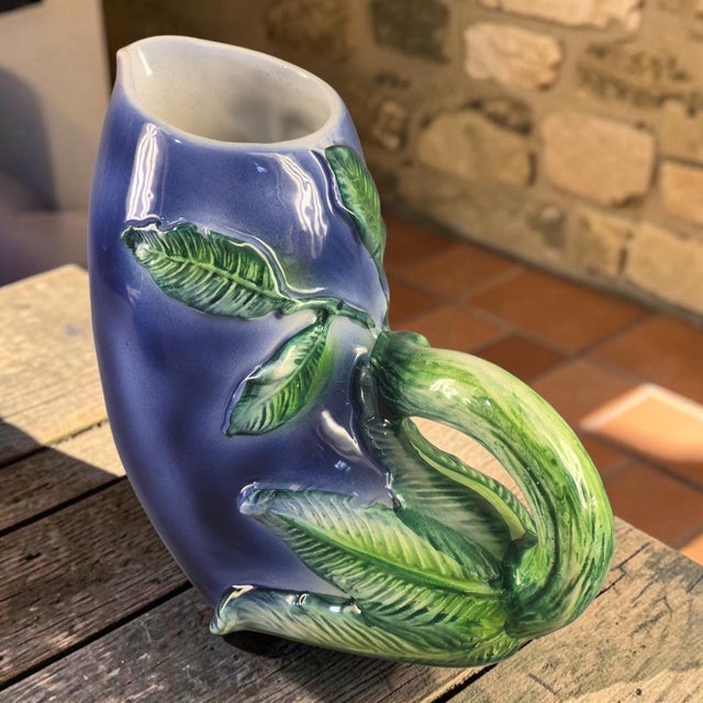 This Vintage Hand Painted Ceramic Eggplant Form Pitcher is a unique and charming piece made in Italy. The pitcher, crafted...