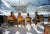 Relaxing in Lech 1960 A group of people sitting in the sun at the Gasthof Post hotel in the Austrian ski resort of Lech,...