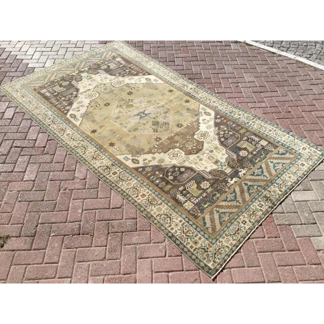 This beautiful, vintage, hand knotted rug is approximately 70 years old. It is handmade, of very fine quality hand-spun...