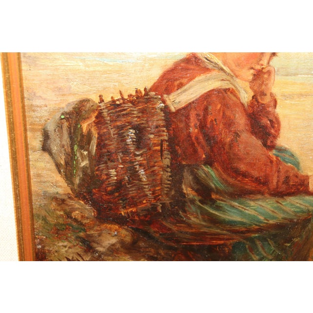 This charming signed oil on board painting from the early 1900s captures a timeless moment of quiet reflection. The...