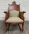 This is a unique and gorgeous antique Victorian mahogany rocking chair dating to the early 20th century. Beautifully...