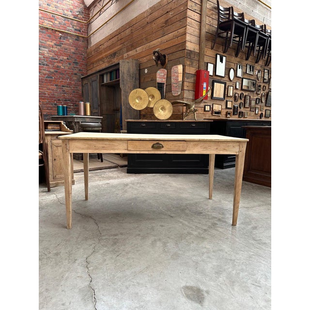 This old country table dating from the early 20th century has been entirely restored. It has a functional drawer on each...