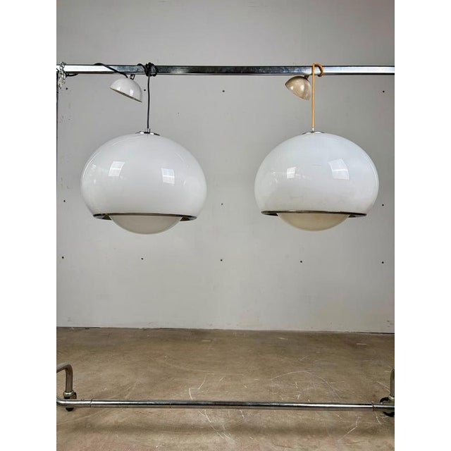Pair of “Bud Grande” Pendant Lamps by Harvey Guzzini, 1960s An elegant pair of “Bud Grande” pendant lamps, designed by...