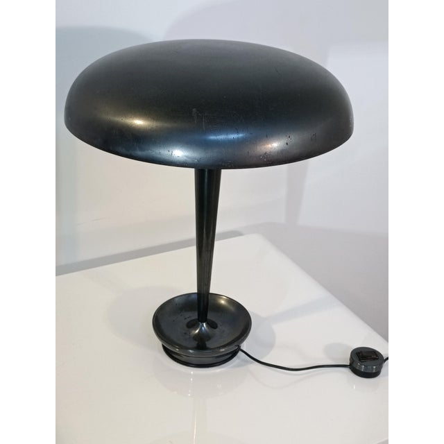 Beautiful designer desk lamp by Metalarte. Spain, 1960s. Gray lacquered metal frame. Curved and very stable base. It...