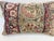 Decorative pillow upholstered in a 19th century Kerman rug fragment, featuring charming floral flowerhead motifs and an...
