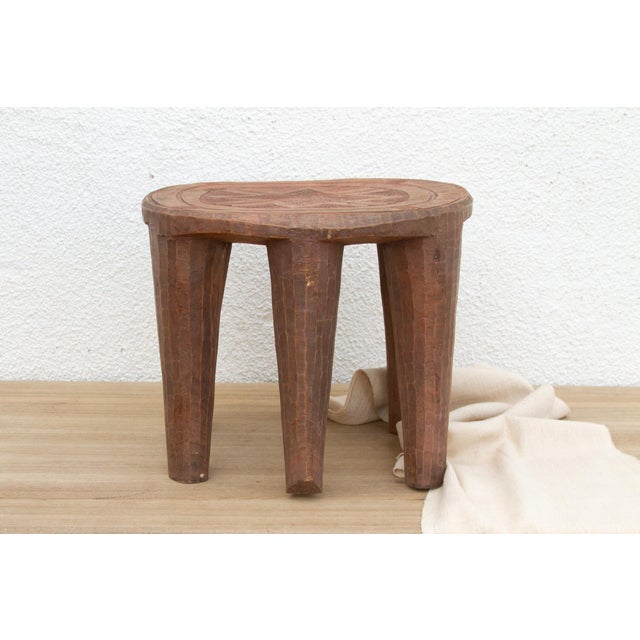 A unique piece of African art, this vintage Nupe table from Nigeria is a must-have for collectors and enthusiasts of Nupe...