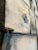 Striking geometric raku-fired clay tile wall sculpture, professionally mounted and framed in a sleek black frame. This...