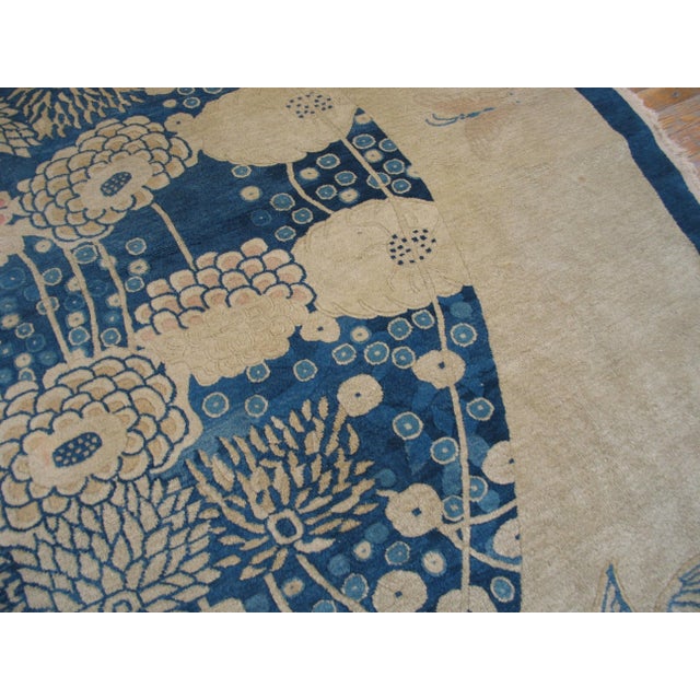 Pretty Floral Design in a Ivory Field & Navy Border Color Antique Round Chinese Peking Rug For Sale - Image 4 of 6