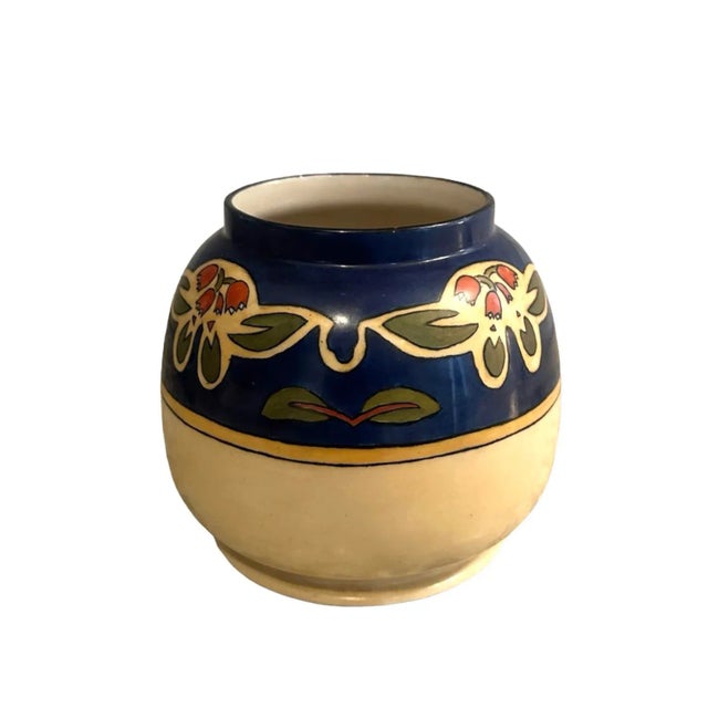 A beautiful, antique American Belleek Ceramic Art Company squat form vase. Features an Arts & Crafts design encircled by...