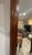 This mirror displays the classic Chippendale style, characterized by its ornate, scrolled mahogany frame with distinct...