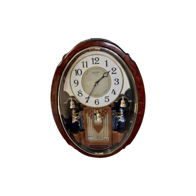Small World Rhythm Musical Motion Clock model 4MH749. Vintage c.1990's. It features (2) animated organists that rotate and...