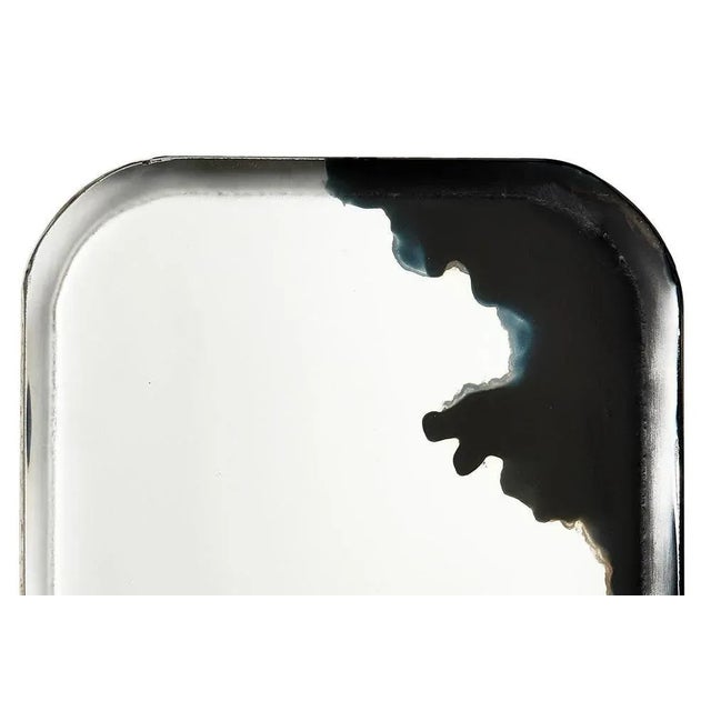 Lava tray by slow design unique piece. Dimensions: d 1 x w 26 x h 34 cm. Materials: glass and pigments. Our mirrors are...