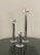 A set of 3 space age chrome pillar lamps with staggered heights. Shown with varying size chrome dipped lightbulbs. Sourced...