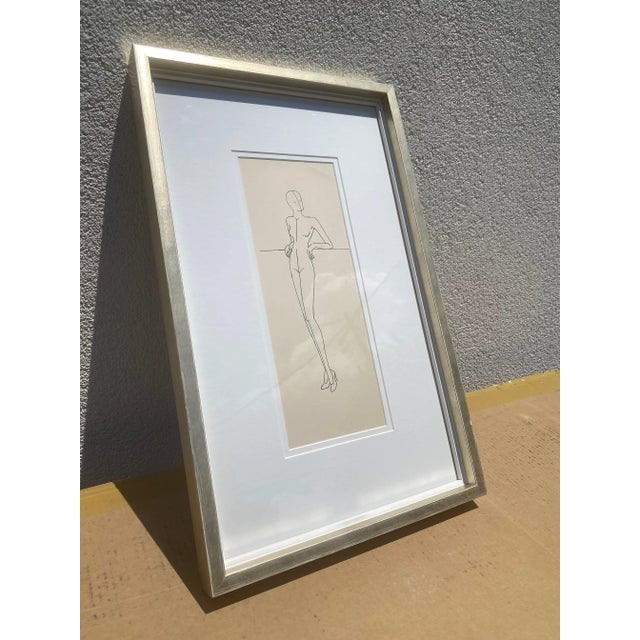 This is a framed vintage fashion illustration. This particular piece features the original mannequin form drawn in ink....