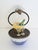 A rare Limoges France La Gloriette painted porcelain glass domed egg which opens to reveal a very detailed champagne...