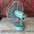 This vintage General Electric desk fan from the 1950s features a charming aqua blue finish with oscillating functionality....