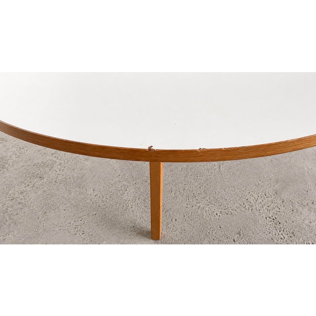 This table is one of the first editions produced by Vitra, with an off-white laminate top and oak edging. (Year of...