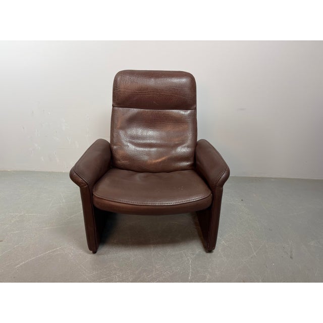 Mid-Century Design De Sede Chocolate Brown Leather Lounge Chair Model DS-50, Switzerland 1970s. A Swiss mid‑century lounge...