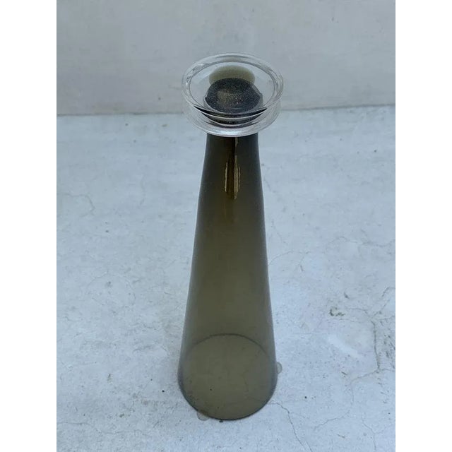 Beautiful candlestick holder in hand blown smoked glass, signed and dated. The piece is in very good condition. 12 3/4"...