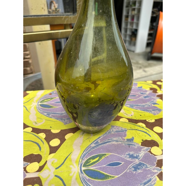Up for consideration is a beautiful green glass skinny neck vase. This would look lovely in your home and it is a great...