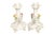 A pair of Italian ceramic candlestick holders in the Capodimonte style, circa 1970, imported by Ardalt Inc. of Madison...