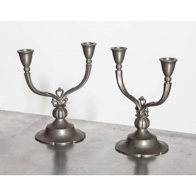 Pair of Just Andersen 6002 Two Arm Pewter Candlesticks, 1929. Featuring Crest details in Satin Silver finish on circular...