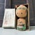 Adorable vintage kokeshi doll in its original 1960s cardboard packaging. Dimensions: Height 12.5 cm (4.9 inches), diameter...