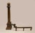Pair of early 20th century bronze andirons with ionic column and brass ball motif.