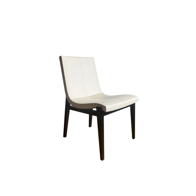 Set of 9 Holly Hunt “Siren” Dining chairs in ivory leather and Ebonized walnut frame. Influenced by mid-century...