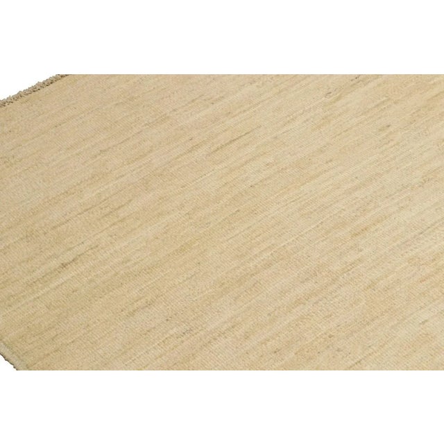 Hand-knotted in wool, this 12'11 " x13 " contemporary rug in beige as an addition to the Rug & Kilim Textural Collection,...