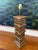 Vintage faux bamboo column table lamp featuring a stacked bamboo motif and warm antiqued bronze finish. The sculptural...