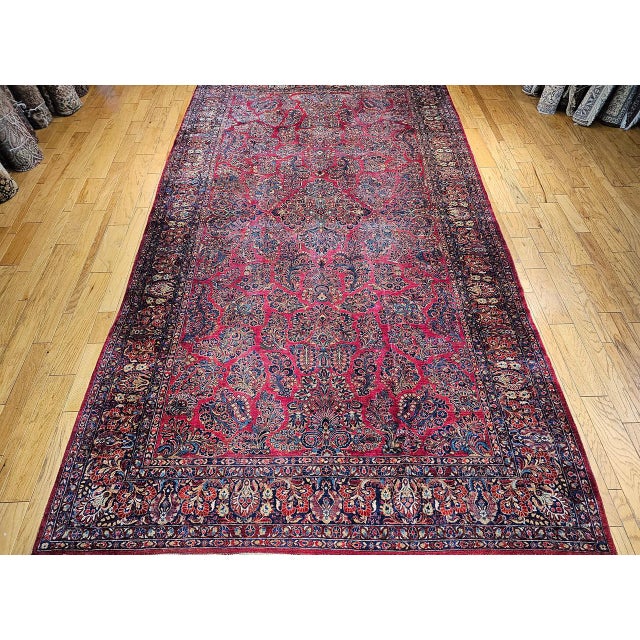 "This vintage oversized Persian Sarouk rug is a radiant example of Sarouk floral artistry at its most generous and...