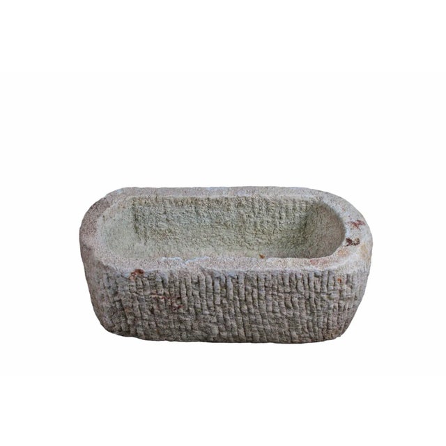 This stone trough is hand carved out one piece of stone and hand chiseled by the locals. This hand made stone planter is...