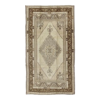 Vintage Turkish Stylized Medallion Oushak Rug in Sandy Neutrals and Earth Tones For Sale