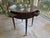 Biltmore Estate Collection Lamp Table crafted in mahogany with a marble top. It features two drawers on each side with...