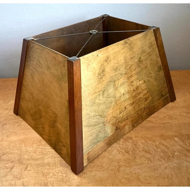 This vintage wooden lampshade makes a handsome sculptural statement, its rectangular, gently tapered silhouette rising...