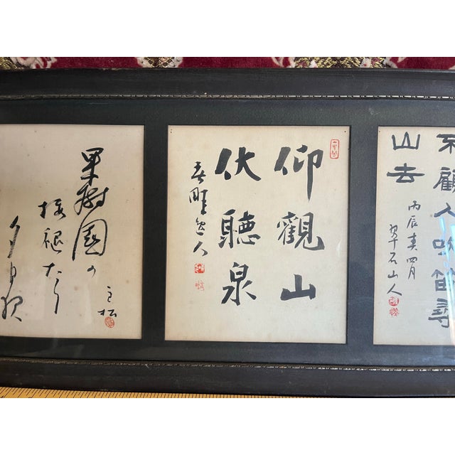 A beautifully aged framed Asian calligraphy under glass. Will definitely add an Asian flair to any room of your home.