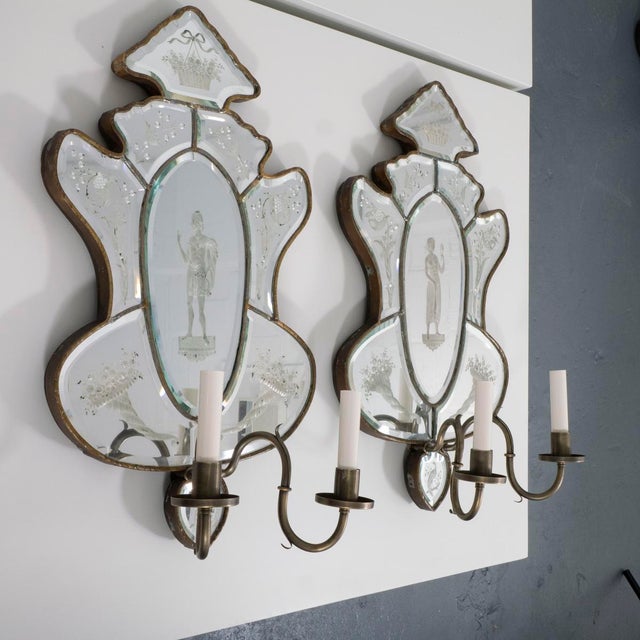 Pair of 19th century Venetian etch mirror wall sconces depicting classical forms and a floral motif.