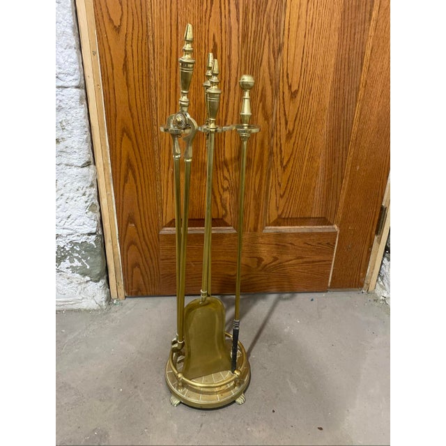 30” tall Add a touch of classic elegance to your hearth with this beautiful 4 piece polished brass fireplace tool set....