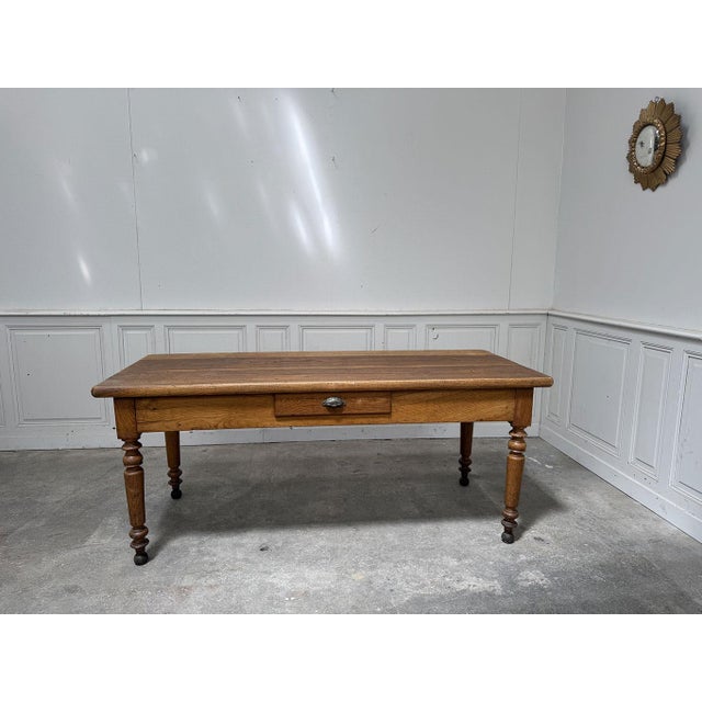 A 180cm long solid oak display or work table (note the superb caramel patina) designed in the 1960s, reminiscent of a...