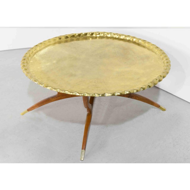 The Mid Century Moroccan Hammered Brass Folding Tray Coffee Table seamlessly enhances both modern and traditional...