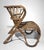 Charming lounge chair crafted from natural rattan and wicker, embodying the refined organic aesthetic that defined...