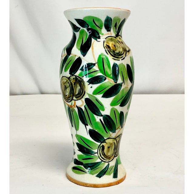 This little vase is so pretty. It features hand painted olives with leaves in multiple shades of green. The ceramic vase...