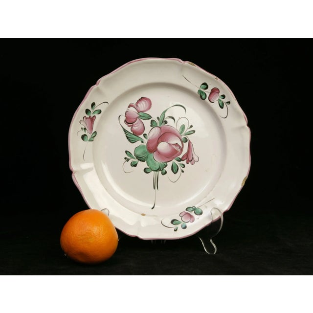 An early iteration of the distinctive motif that was produced by St. Clement and its sister pottery Luneville, beginning...