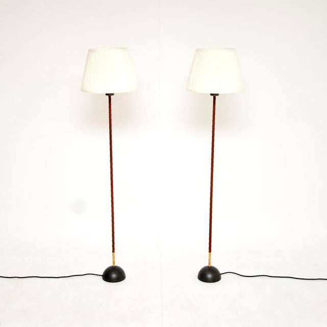A stylish and extremely well made pair of vintage Swedish leather bound floor lamps. They were recently imported from...