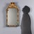 Carved and lacquered wood mirror from mid-19th century Italy. Features a masterfully crafted frame with leafy and floral...