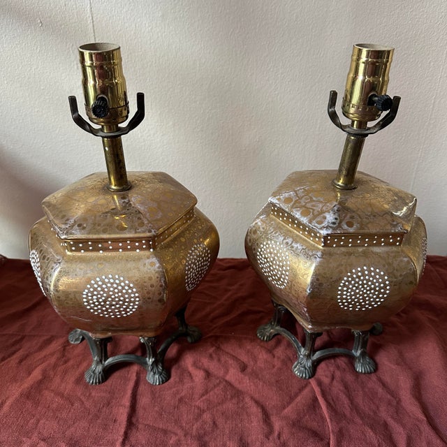 Beautiful pair of mid 20th century hexagonal Japanese porcelain table lamps with a brass top and bronze claw footed base....