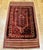 An exquisite early 20th century Baluch tribal area rug crafted with exceptional detail and artistry, featuring a...