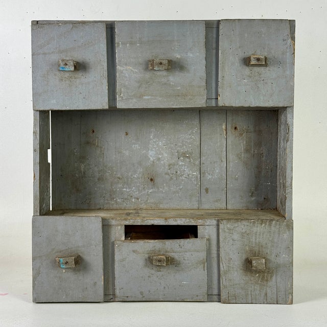 A very sweet hand made wall cabinet. It's primitively made and very utilitarian. "Top craftsmanship" was not the goal...