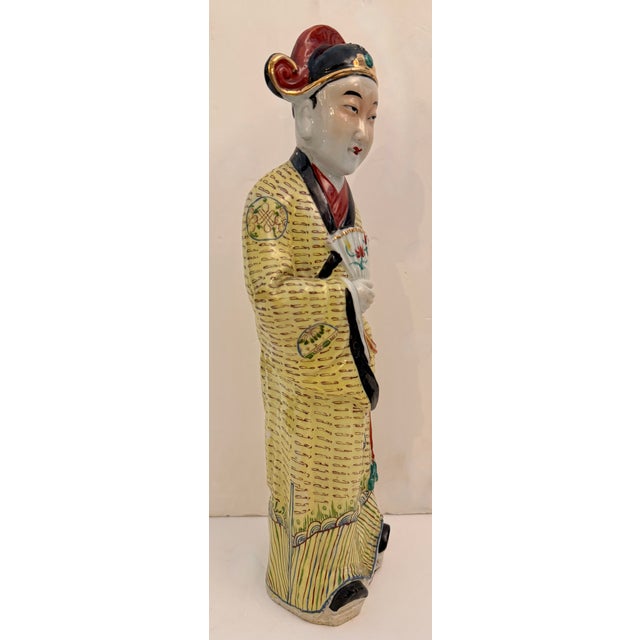 Chinese porcelain figurine, likely from the Republic period (early 20th century). It is crafted from porcelain and...